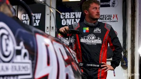 Race car driver in garage on best IPTV UK - stream motorsports coverage with IPVision